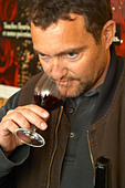 Yves Cuilleron, owner and winemaker. Tasting a glass of wine. Domaine Yves Cuilleron - A2KDK2